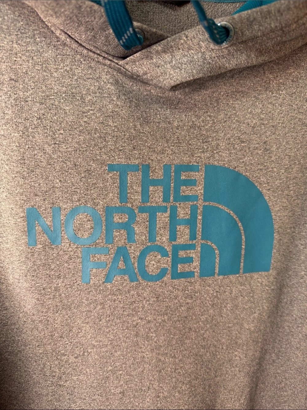 The North Face Men’s Heather Gray Pullover Hoodie with Teal Logo
